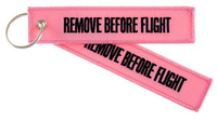 Breloczek REMOVE BEFORE FLIGHT różowy